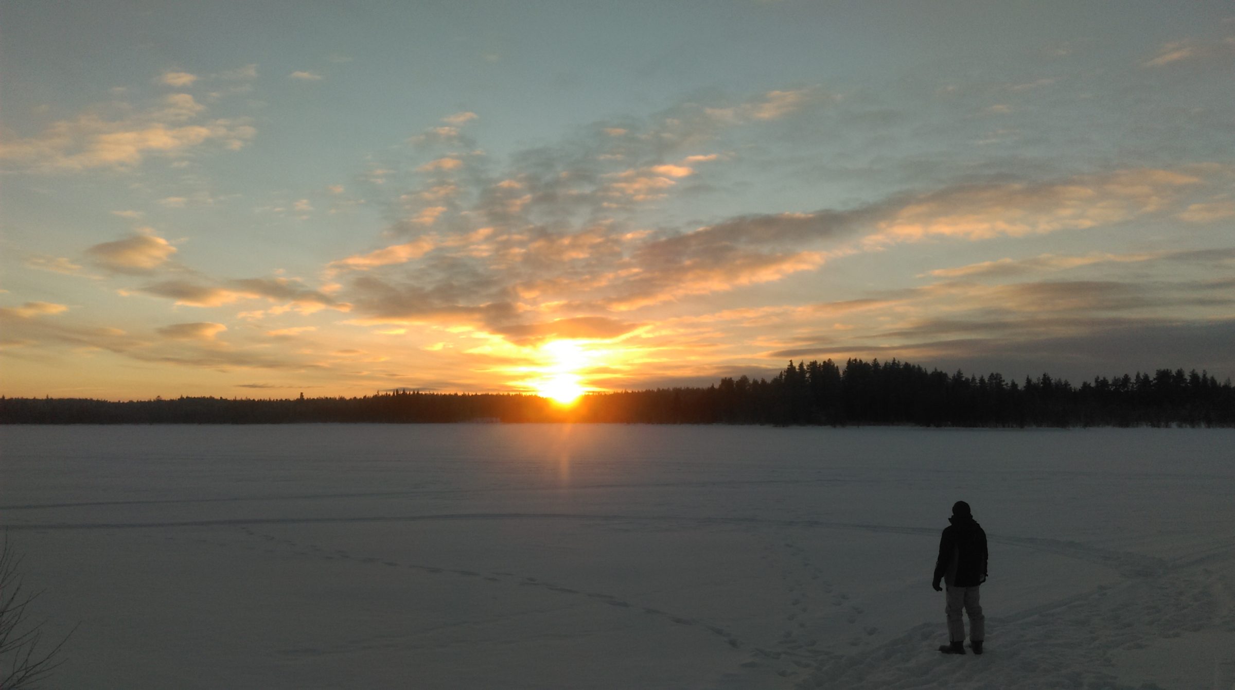 Sunrise over Frozen Lake in Lapland Sweden