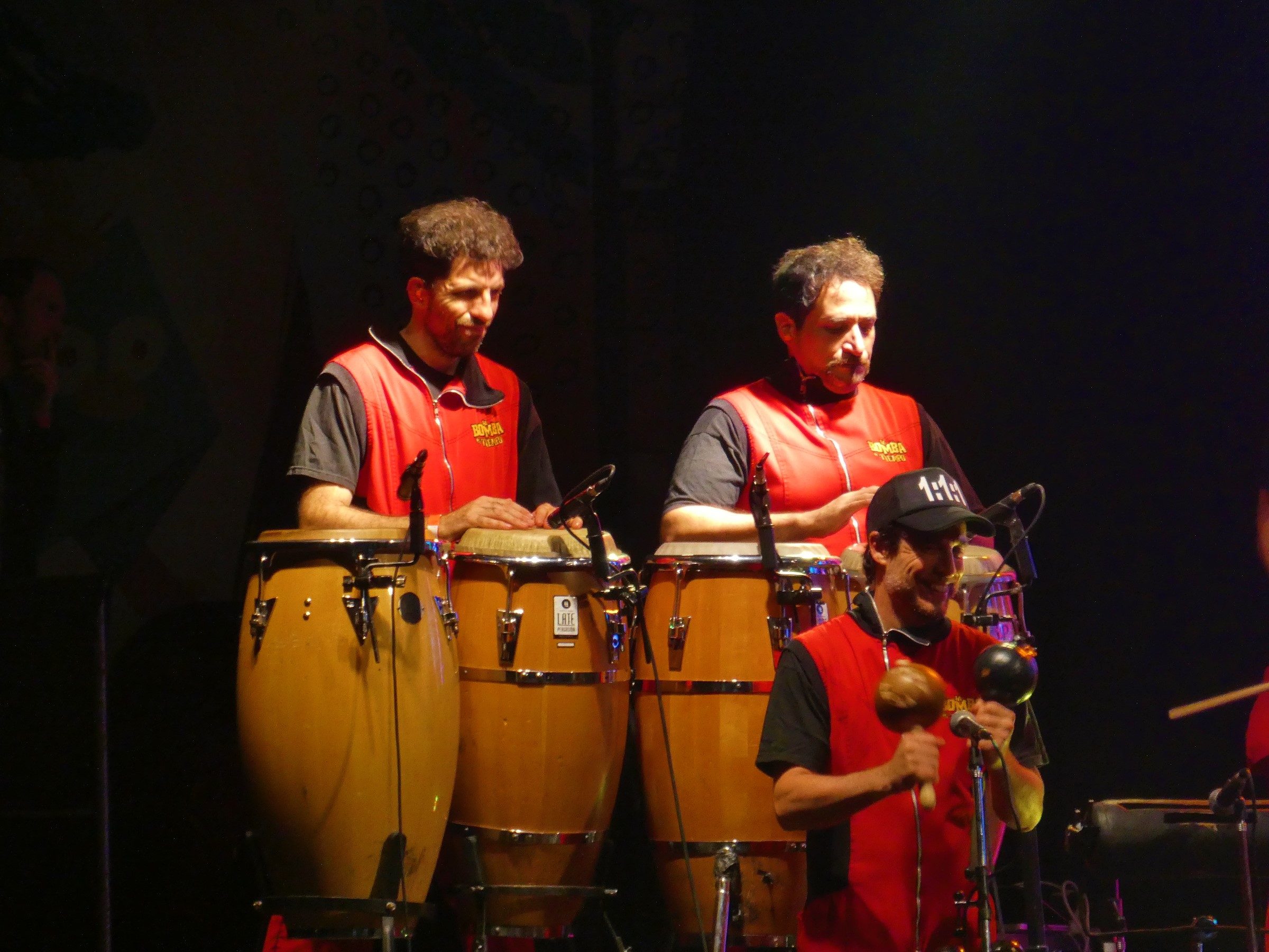 Bongo players with La Bomba de Tiempo