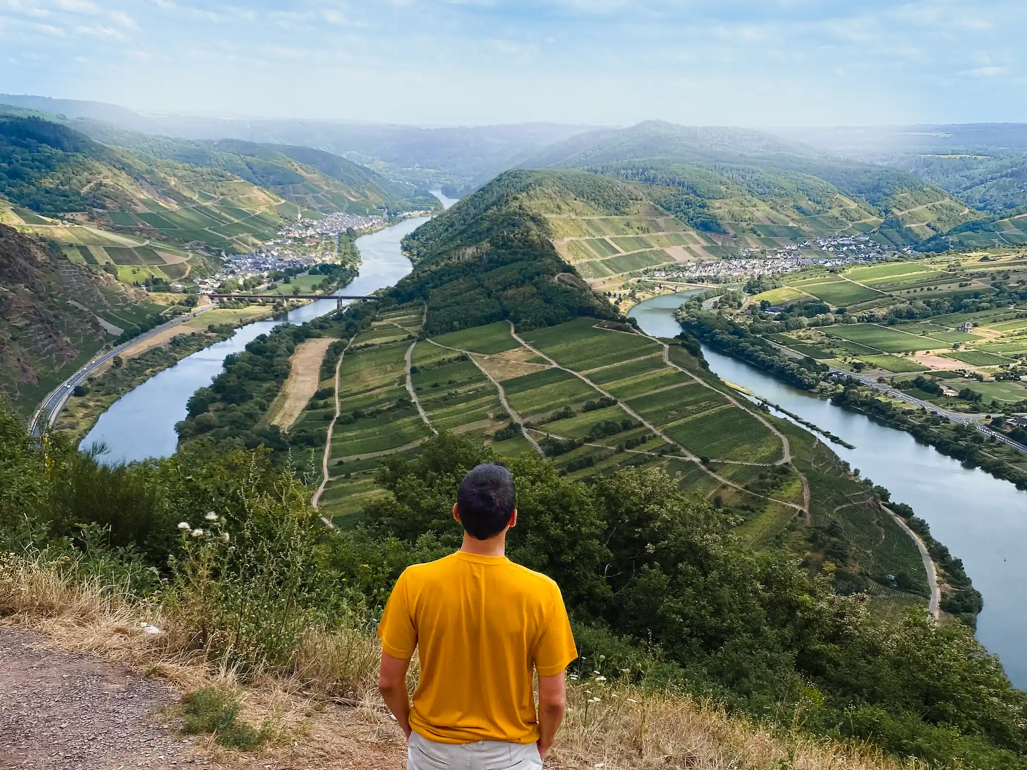 Man looking at the Moselle Bend near Bremm, Germany