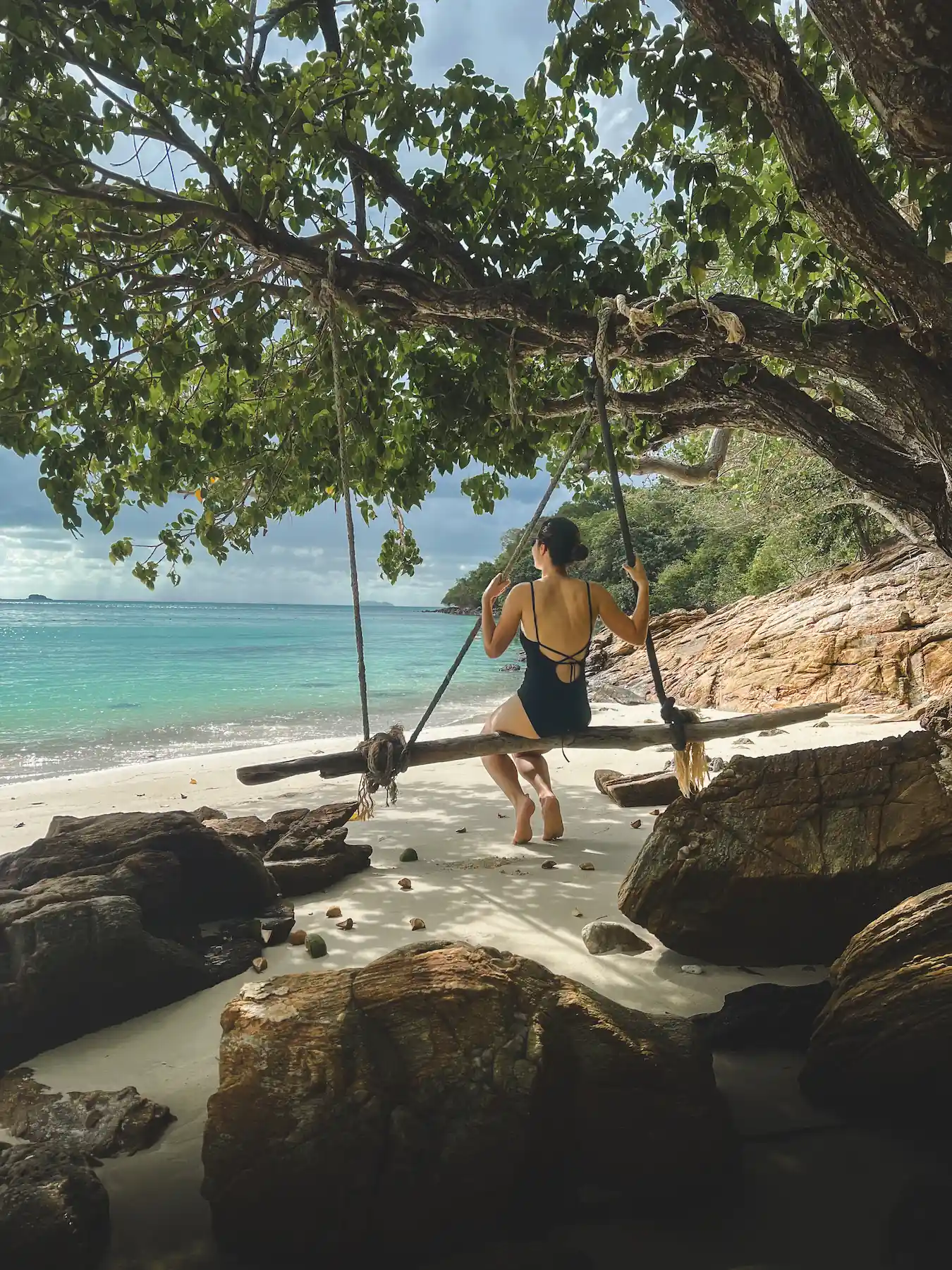 Woman swinging at beach in Koh Samed