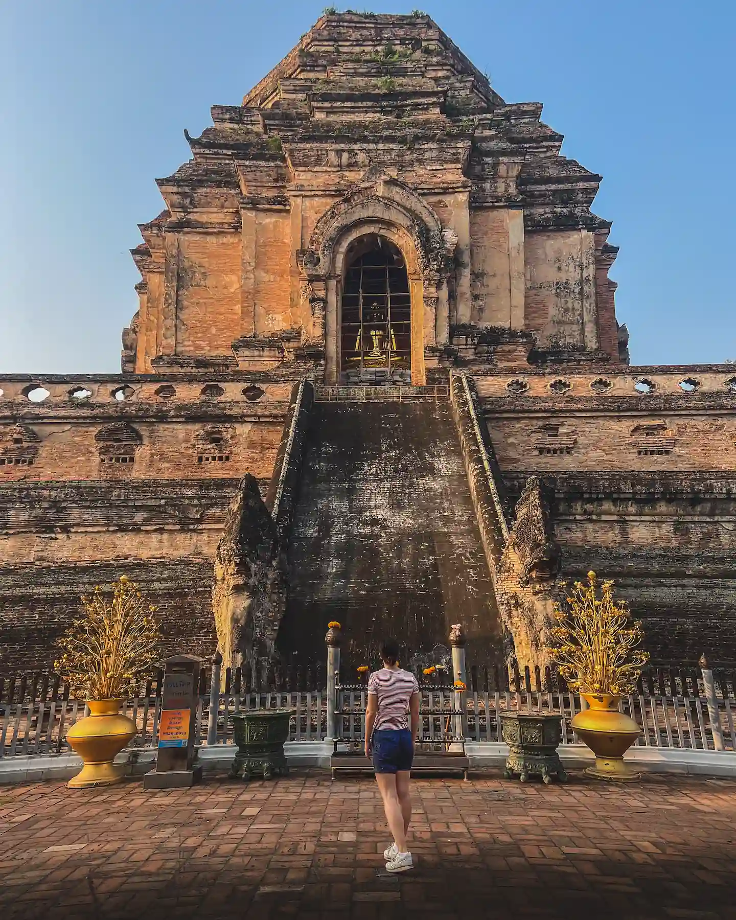 Woman looking at Wat Chedi Luang temple in Chiang Mai